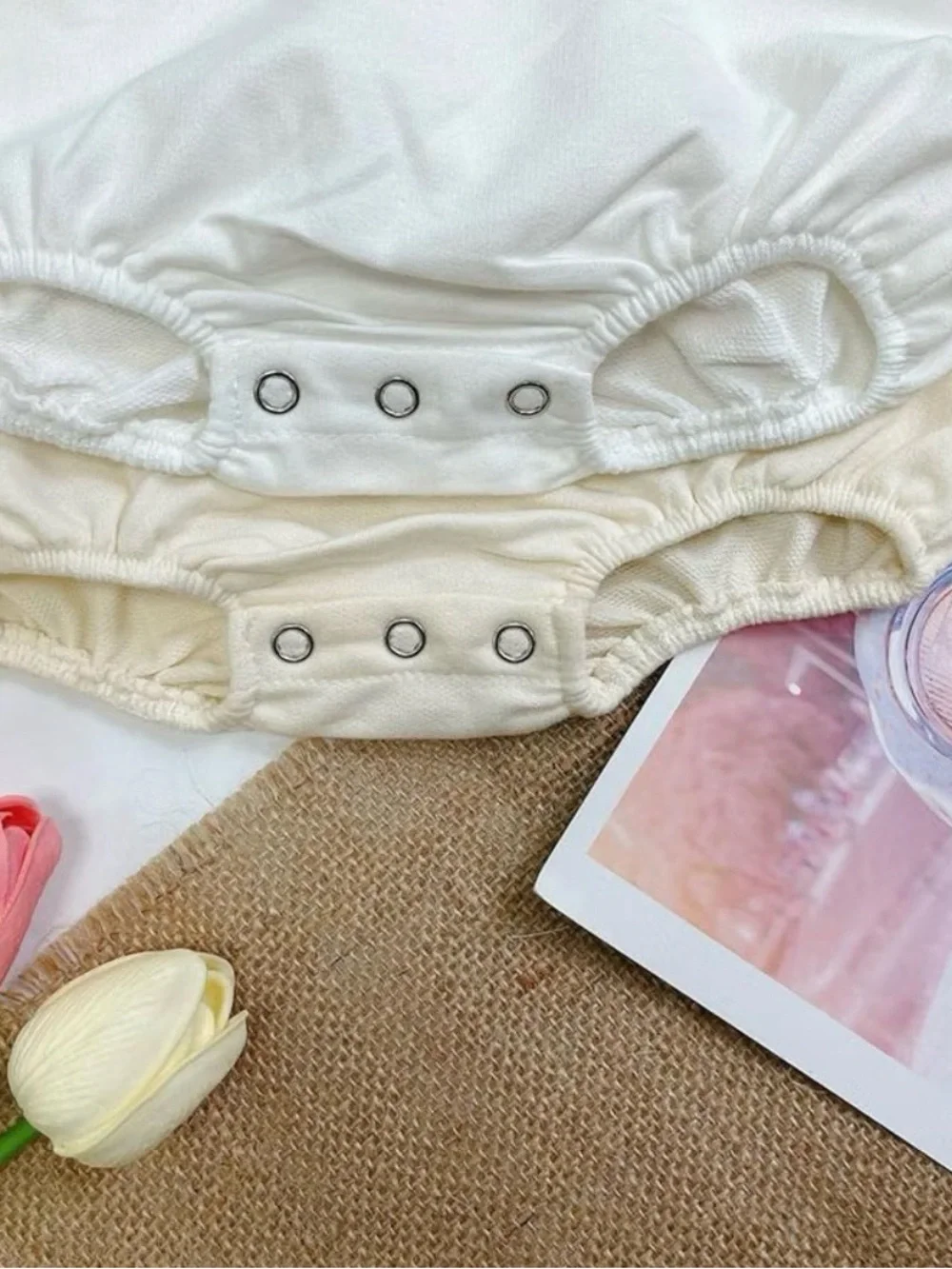 Cream Baby Diaper Cover Bodysuit with Pink Accent